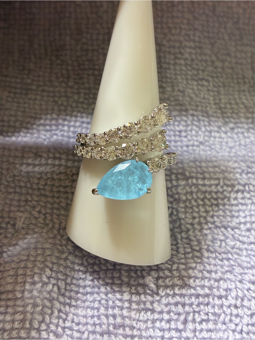 Silver Ring with Light Blue Teardrop Crystal and Clear CZ Bands